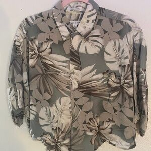 Tiki with a TIE in the front. Size LARGE.